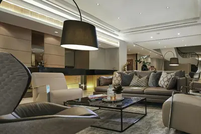 a living room with a couch and a table at AC Hotel by Marriott Kuala Lumpur in Kuala Lumpur