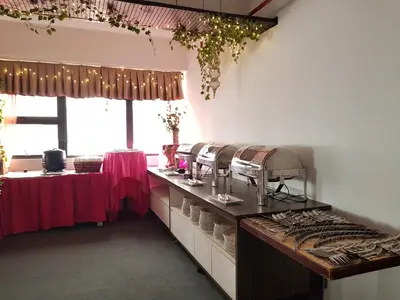 a kitchen with a counter with dishes on it at WTC Hotel, Kuala Lumpur - Formerly Leo Palace Hotel Classic Wing in Kuala Lumpur