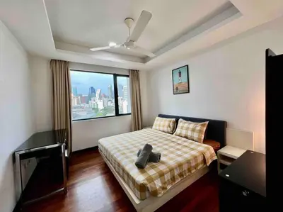 a bedroom with a bed and a large window at Casa Residency Apartment in Kuala Lumpur