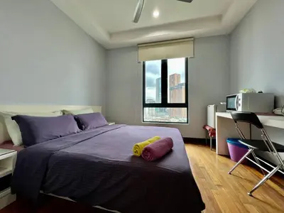 a bedroom with a bed with a yellow toy on it at Casa Residency Apartment in Kuala Lumpur