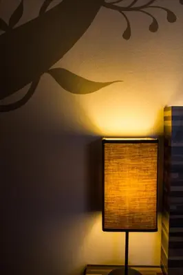 a lamp sitting on a table in a room at The 5 Elements Hotel Chinatown Kuala Lumpur in Kuala Lumpur