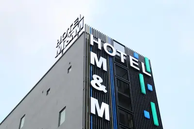a building with the words mortel and mm on it at M&M Hotel in Kuala Lumpur