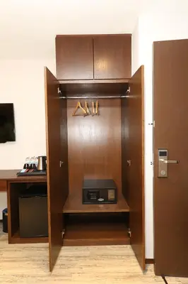 a door to a room with a desk and a box at M&M Hotel in Kuala Lumpur