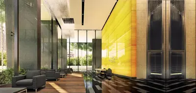 a lobby of a building with chairs and tables at Dorsett Residences Bukit Bintang @Dorsett Kuala Lumpur in Kuala Lumpur