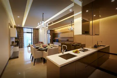 a kitchen and living room with a table and a dining room at Dorsett Residences Bukit Bintang @Dorsett Kuala Lumpur in Kuala Lumpur