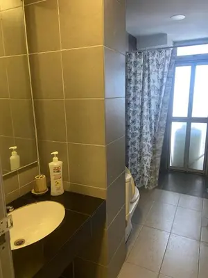 a bathroom with a sink and a window at Arina Unity in Kuala Lumpur