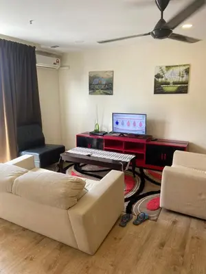 a living room with a couch and a piano at Arina Unity in Kuala Lumpur