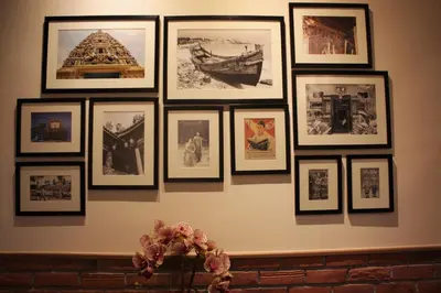 a group of pictures on a wall at Ahyu Hotel in Kuala Lumpur