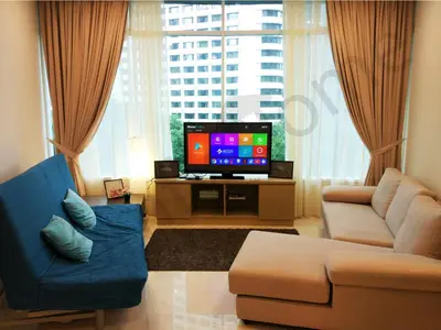 a living room with a couch and a tv at 5 STAR & LUXURY Apartment near KLCC/ KL City Centre in Kuala Lumpur