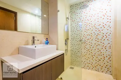 a bathroom with a sink and a shower at Regalia Residence @ KLCC View Sky Pool by MC in Kuala Lumpur