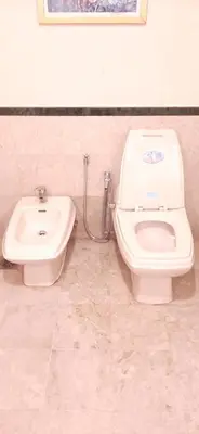 a bathroom with a toilet and a bidet at Genius Service Suites at time square kl in Kuala Lumpur