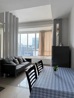 a living room with a table and a couch at Parkview Suite KLCC, Myhomey in Kuala Lumpur