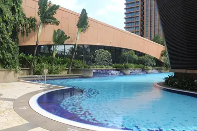 a large swimming pool in front of a building at FnF Suite @ Time Square in Kuala Lumpur