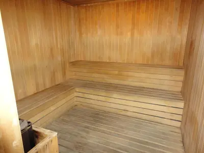 a wooden sauna with a wooden floor and a wooden at FnF Suite @ Time Square in Kuala Lumpur