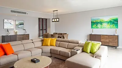 a living room with a couch and a table at TRILLION SUITES by SLG in Kuala Lumpur