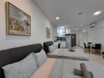 a living room with a couch and a table at Inspired Homes @ Summer Suite in Kuala Lumpur