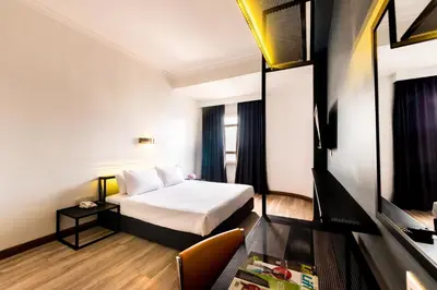a hotel room with a bed and a table at Hotel Sentral Pudu @ City Centre / Bukit Bintang in Kuala Lumpur