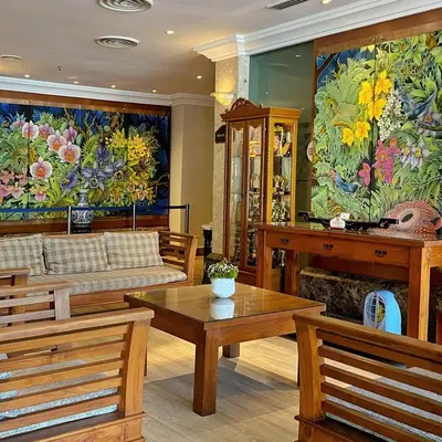a living room with a couch and a fireplace at Hotel Maluri in Kuala Lumpur
