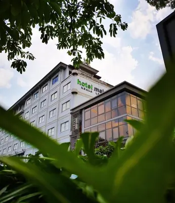 a hotel building with a sign on top of it at Hotel Maluri in Kuala Lumpur