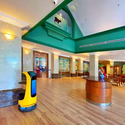 a lobby with a bar in the middle of a room at Hotel Maluri in Kuala Lumpur