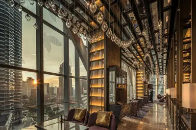a room with a view of a city at Four Seasons Hotel Kuala Lumpur in Kuala Lumpur