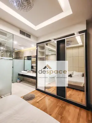 a bedroom with a large glass window with a bed at Dorsett Bukit Bintang Residence by De Space in Kuala Lumpur