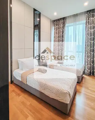 a bedroom with two beds and a window at Dorsett Bukit Bintang Residence by De Space in Kuala Lumpur