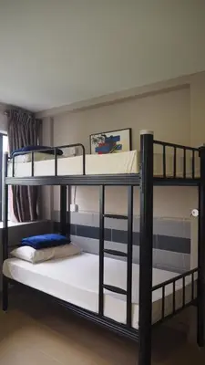 two bunk beds in a room withthritisthritisthritisthritisthritisthritisthritisthritisthritis at Leo Backpackers @ Central Market in Kuala Lumpur