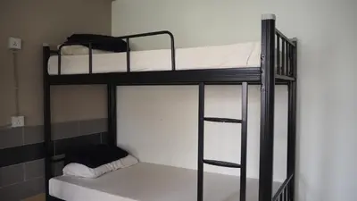 a couple of bunk beds in a room at Leo Backpackers @ Central Market in Kuala Lumpur
