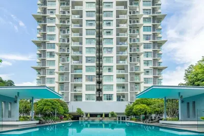 a swimming pool in front of a large apartment building at Suasana Bukit Ceylon Residence in Kuala Lumpur