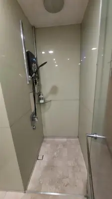 a room with a shower with a propeller on the wall at Inspired Homes @ KLCC Soho Suite in Kuala Lumpur