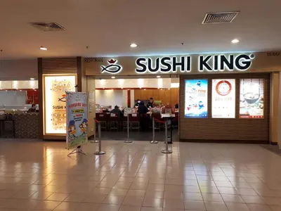 a sushi king restaurant with people sitting at tables at Robinsons at Times Square Kuala Lumpur in Kuala Lumpur