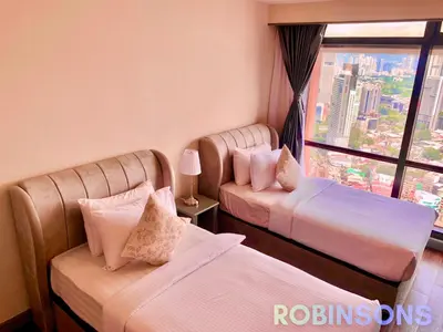 a hotel room with two beds and a window at Robinsons at Times Square Kuala Lumpur in Kuala Lumpur
