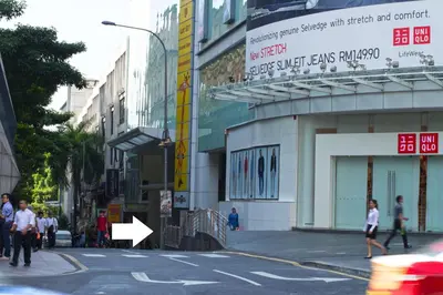 a city street with people walking on the street at Fahrenheit Suites Bukit Bintang, Kuala Lumpur in Kuala Lumpur