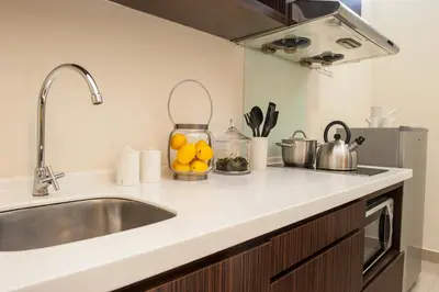 a kitchen with a sink and a counter top at Fahrenheit Suites Bukit Bintang, Kuala Lumpur in Kuala Lumpur