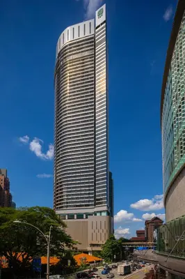 a tall building with a sign on top of it at Banyan Tree Kuala Lumpur in Kuala Lumpur