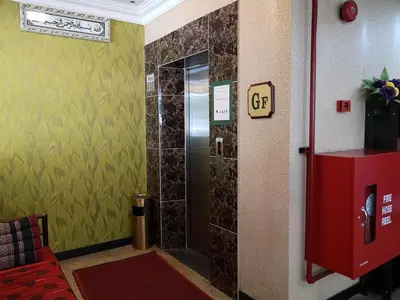 a bathroom with a shower with a glass door at Hotel Grand Palace Ampang in Ampang