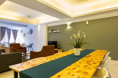 a dining room with a yellow table and chairs at The Forum Condominium by LaFabrica in Kuala Lumpur