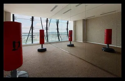 a room with a mirror and a view of the ocean at Mcity Jalan Ampang in Kuala Lumpur