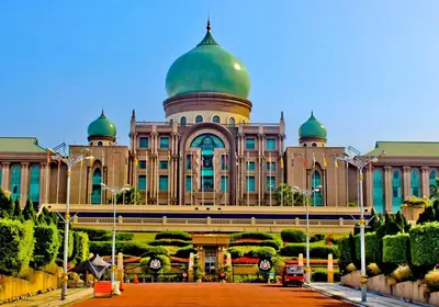 a building with a green domes on top of it at CITI HOTEL @ KL SENTRAL in Kuala Lumpur