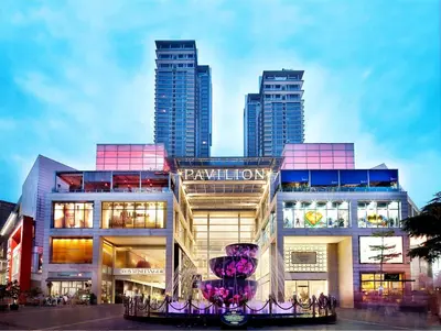 a building with a sign on it in front of a city at CITI HOTEL @ KL SENTRAL in Kuala Lumpur