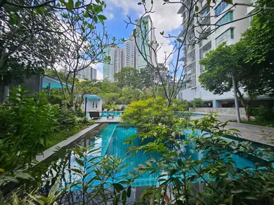 a swimming pool in a city with tall buildings at Holiday Paradise in Kuala Lumpur