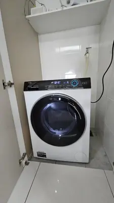 a washer and dryer in a small room at Holiday Paradise in Kuala Lumpur