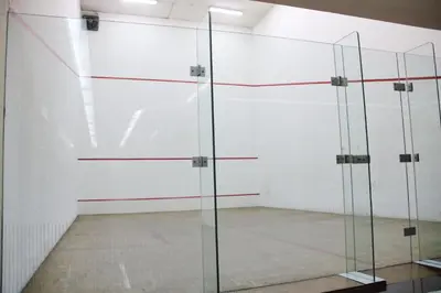a room with glass doors in a white wall at The Maple Suite in Kuala Lumpur