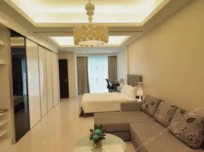 a living room with a couch and a bed at Damas Suites & Residences Kuala Lumpur in Kuala Lumpur