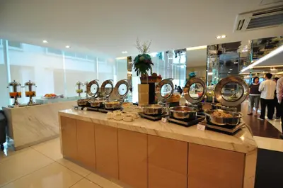 a buffet in a store with many pots and pans at Damas Suites & Residences Kuala Lumpur in Kuala Lumpur