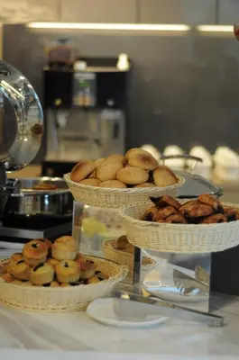 three baskets of food sitting on top of a counter at Damas Suites & Residences Kuala Lumpur in Kuala Lumpur