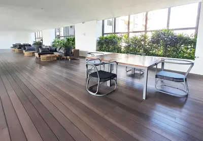 a dining room with a table and chairs in a building at KL Sentral, EST Bangsar by SkyLimit Suites in Kuala Lumpur