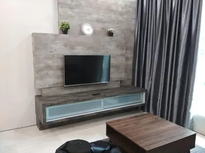 a living room with a flat screen tv on a wall at Soho Suites KLCC by Elite in Kuala Lumpur