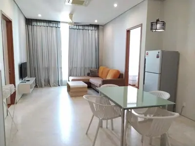 a living room with a table and a couch at Soho Suites KLCC by Elite in Kuala Lumpur